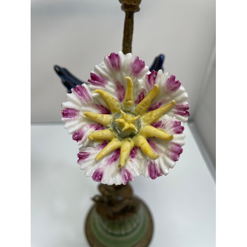 461 - A pair of bronze figural candlesticks by Mark Roberts, with colourful porcelain birds perched on twi... 