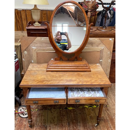 558 - An Edwardian satinwood dressing table with a pair of inlaid drawers with brass 'gothic revival' hand... 