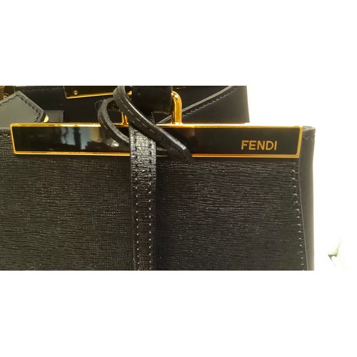 374 - A Fendi 3Jours black leather tote bag with gold coloured bars to the base of the straps and a black ... 