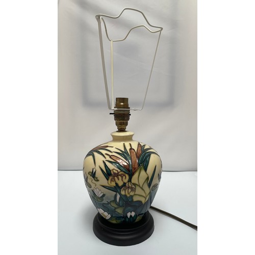 23 - A Moorcroft Pottery lamp in the Bullrush design, of tapering cylindrical form, on stepped, circular ... 