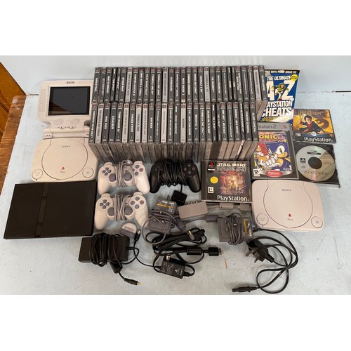 329 - Two Playstation 1. consoles and a Competition Pro LCD screen, together with a Playstation 2. console... 