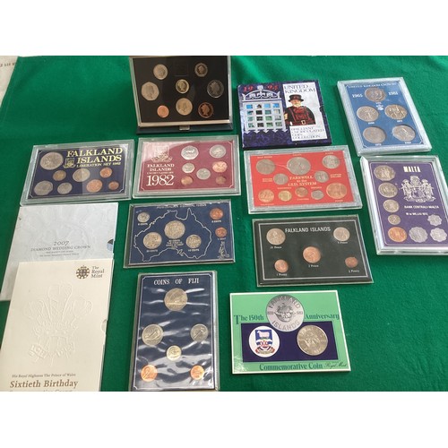 292 - A suitcase containing several hundred UK and foreign coins – including two albums of mixed coinage f... 