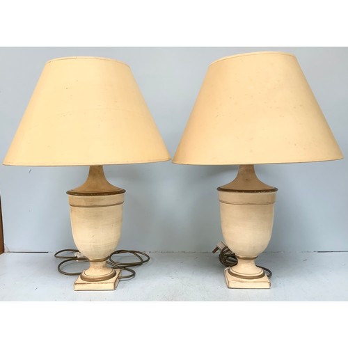 465 - A pair of Laura Ashley cream and gold ‘antiqued’ urn shaped lamps with cream shades (not tested)