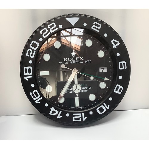 166 - A Rolex Oyster Perpetual GMT-Master II dealer's shop display advertising wall clock, the black dial ... 