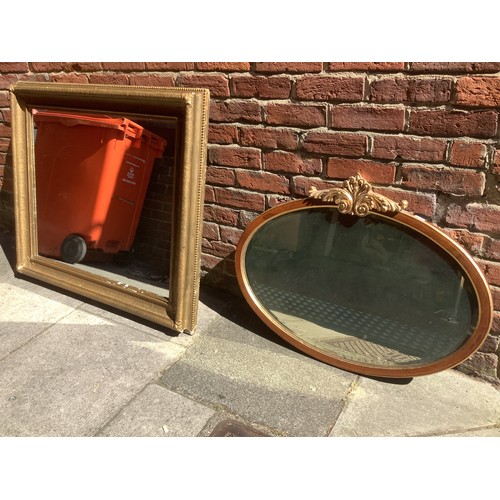 466 - An oval Edwardian inlaid mirror with gold foliate crest and gilt edges, 90cm wide, together with a g... 