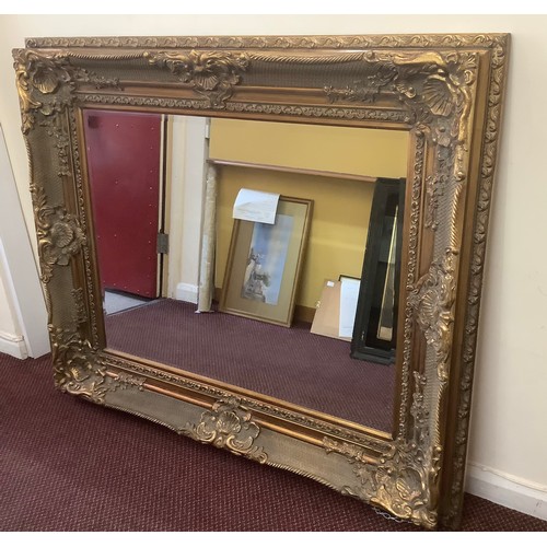 464 - A large ornate Westminster Gold rectangular mirror, 140 x 115cm