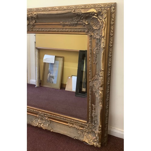 464 - A large ornate Westminster Gold rectangular mirror, 140 x 115cm