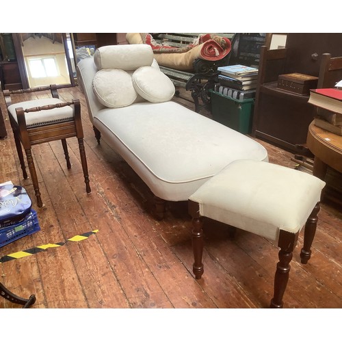 560 - A Victorian chaise lounge re-upholstered in cream damask fabric with bolster and two matching cushio... 