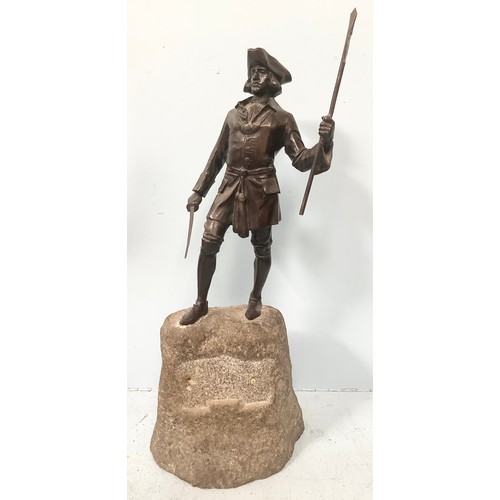 518 - A bronze figure of an 18th century gent in tricorn hat and frock coat holding a sword in one hand an... 