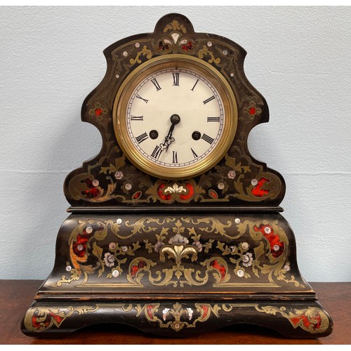 450 - A 19th century black lacquered mantel clock, scalloped shaped case with floral brass, mother of pear... 