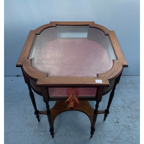 584 - A stained walnut bijouterie table with shaped top, inlaid floral canted corners, red velvet lined in... 