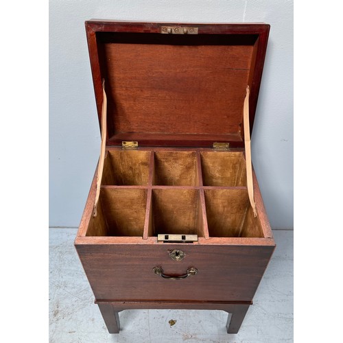 592 - A George III mahogany wine cellarette, of rectangular form, hinged cover enclosing six compartments,... 