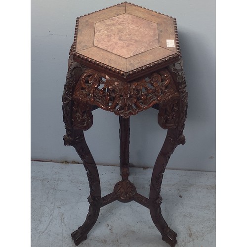 545 - A late 19th / early 20th century Chinese marble-topped jardiniere stand, with hexagonal beaded top, ... 