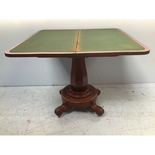 571 - An early Victorian stained mahogany folding card table, of rectangular form, the top enclosing a gre... 