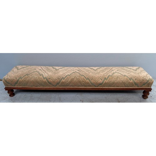 590 - An Edwardian parlour sofa, with curved back, beige upholstered stuff-over seat and back, raised on t... 