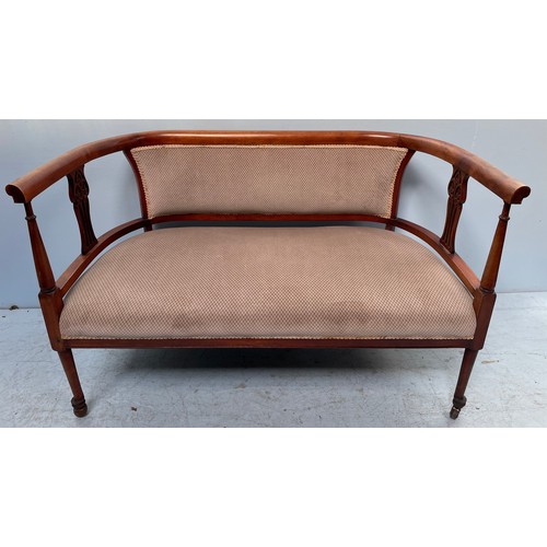 590 - An Edwardian parlour sofa, with curved back, beige upholstered stuff-over seat and back, raised on t... 