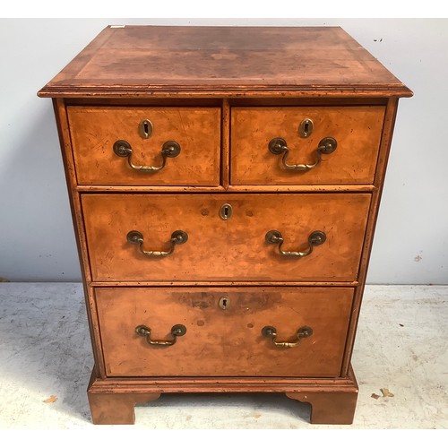 598 - A good quality reproduction burr walnut narrow chest of two short and two long graduated drawers, wi... 