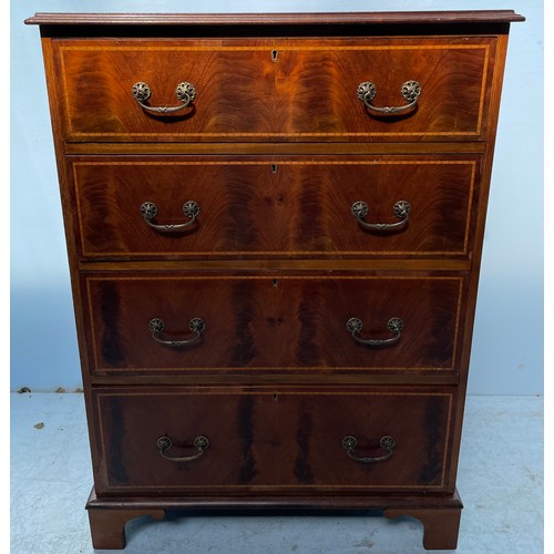 599 - An Edwardian mahogany cross-banded chest of four long graduated drawers with brass handles, raised o... 