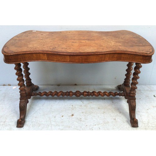 593 - A burr walnut side table with shaped top, four barley-twist supports and stretcher, further raised o... 