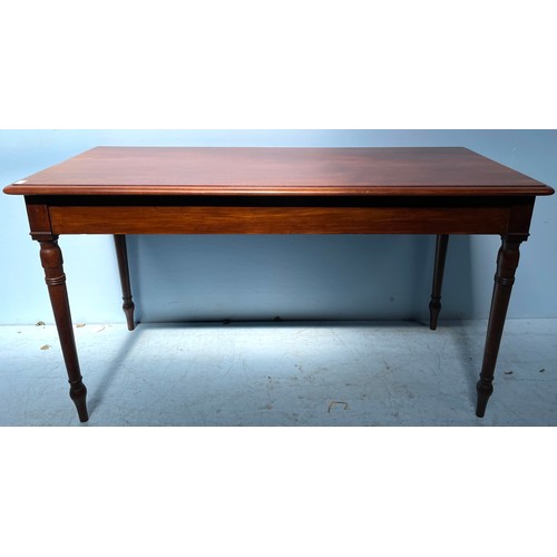 594 - A 19th century mahogany side table, raised on turned supports, 135cm wide