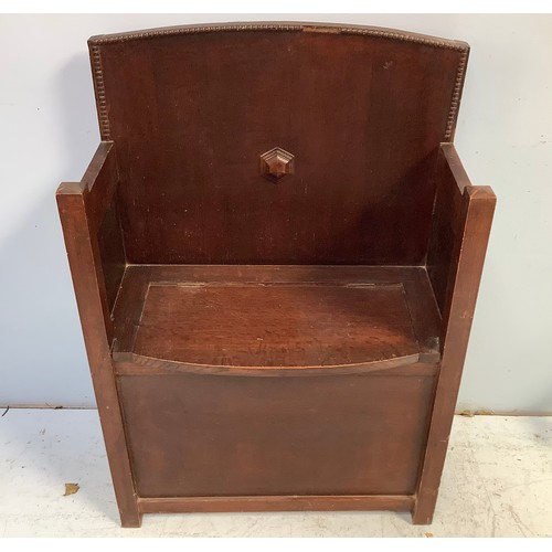 567 - A 19th century stained oak settle, with beaded arched back, lid in seat for storage, raised on squar... 