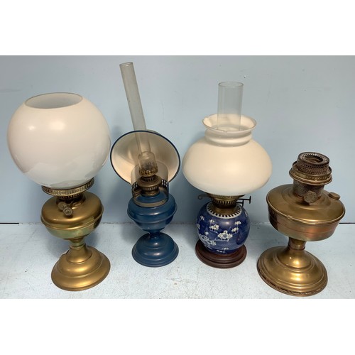 463 - Four various oil lamps including one converted from a Chinese ginger jar (4)