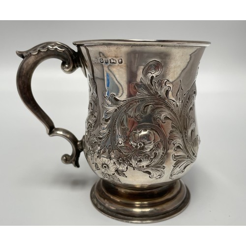 112 - A silver christening tankard, embossed with flowers and central cartouche engraved with crest, Sheff... 