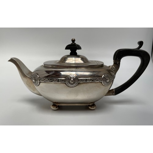 109 - An Arts & Crafts silver three-piece bachelor’s tea service comprising teapot with ebonised finial an... 