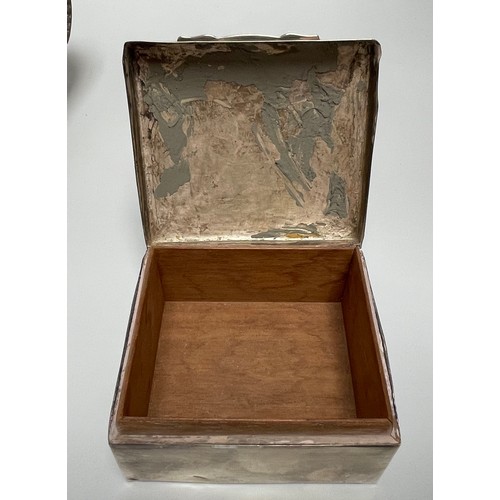 105 - A silver cigarette box with cedar lining, 9.5cm wide, together with a pierced basket marked ‘Sterlin... 