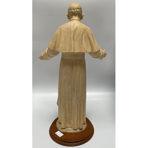 7 - A large composite model of a Pope, possibly John Paul II, in long robes with crucifix necklace and h... 