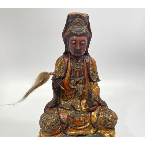 65 - An 17th/18th century finely carved wood, gesso and polychrome seated Bodhisattva/Buddha, modelled wi... 