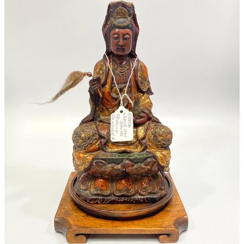 65 - An 17th/18th century finely carved wood, gesso and polychrome seated Bodhisattva/Buddha, modelled wi... 