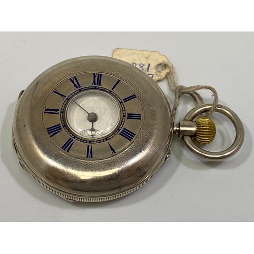 130 - A silver cased keyless half-hunter pocket watch, the white enamel dial with Roman numerals denoting ... 