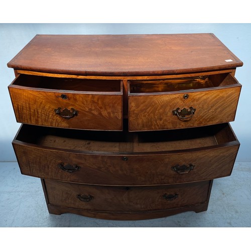 582 - A 19th century mahogany bow-front chest of two short and three long flamed graduated drawers with br... 