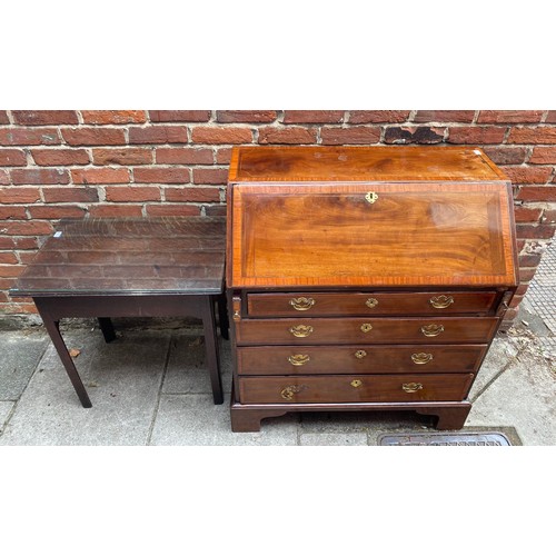 611 - An inlaid walnut bureau with fall front opening to reveal compartmented interior and secret compartm... 