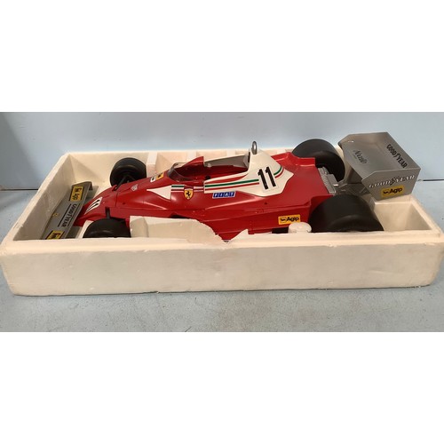 577 - A Toschi promotional model of a Ferrari Formula 1 car with a bottle of Nocino liqueur, 70cm long, bo... 