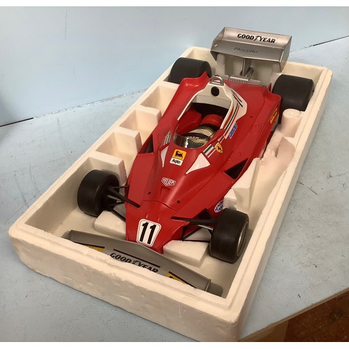 577 - A Toschi promotional model of a Ferrari Formula 1 car with a bottle of Nocino liqueur, 70cm long, bo... 