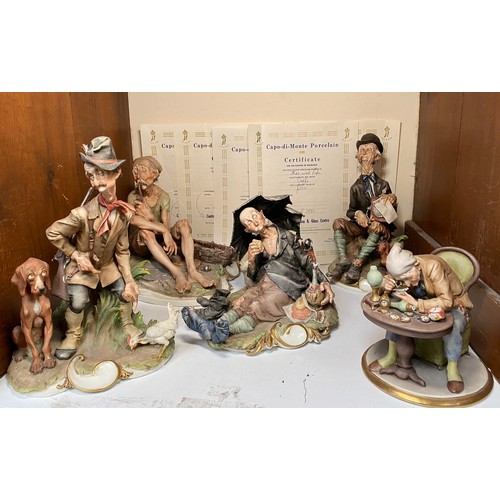 34 - Five various Capodimonte porcelain figure groups including a Watchmaker, an Organ Grinder with a Dac... 