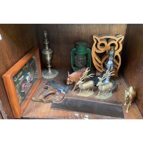 338 - Three shelves of mixed collectables including a rectangular pierced foliate mirror, green paraffin l... 