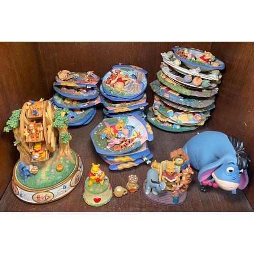 41 - A quantity of Winnie the Pooh decorative items including a ceramic Disney ‘Hunny of a Day’ musical F... 