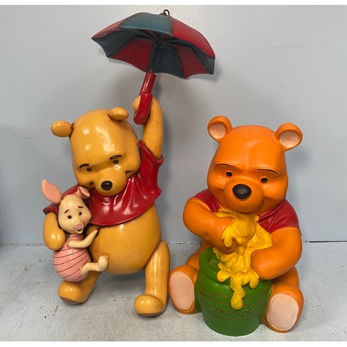 41 - A quantity of Winnie the Pooh decorative items including a ceramic Disney ‘Hunny of a Day’ musical F... 