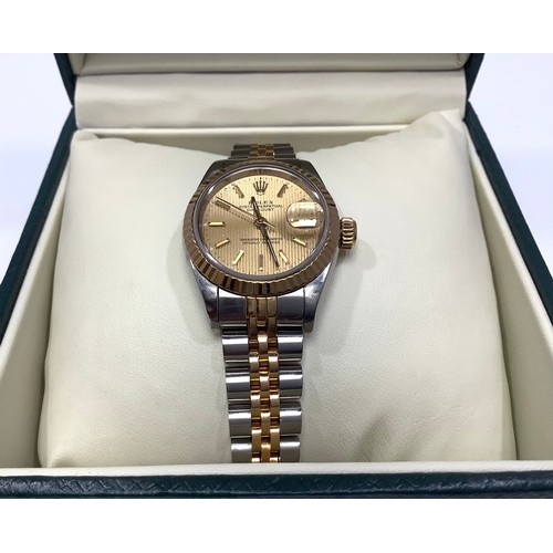 243 - A ladies 18ct yellow gold and stainless steel 'Rolesor' Rolex Datejust wristwatch, the gold pinstrip... 