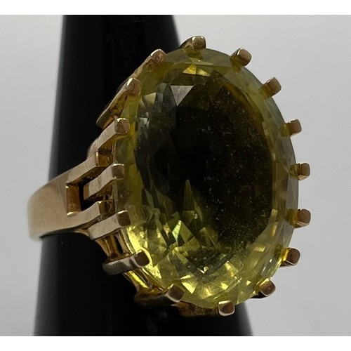 230 - A lady’s 14ct gold dress ring, 16-claw set with a large oval citrine coloured stone, 20x15mm, maker ... 