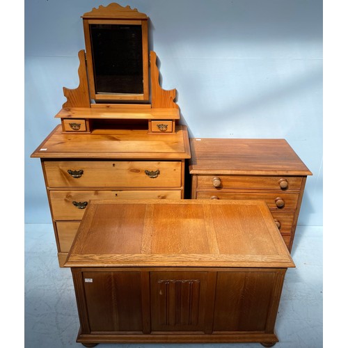 550 - A pine dressing table with mirrored back above a chest of three graduated long drawers, raised on sh... 