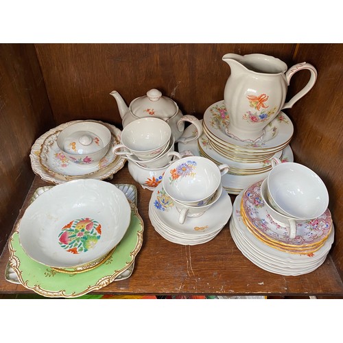 38 - Three shelves of mixed ceramics including a Chinese famille rose bowl with Jiaqing mark to base, blu... 