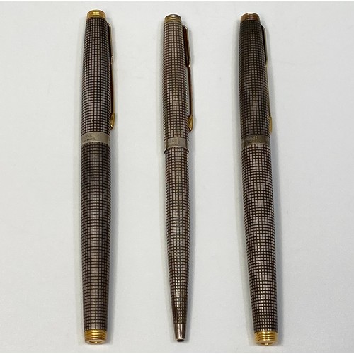 392 - Two Parker 75 Cisele fountain pens with silver caps and barrels and 14ct gold nibs, together with an... 