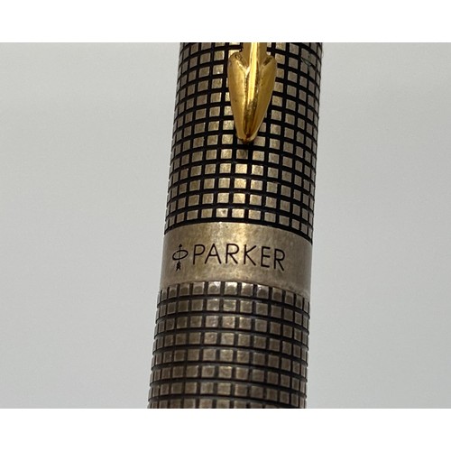 392 - Two Parker 75 Cisele fountain pens with silver caps and barrels and 14ct gold nibs, together with an... 