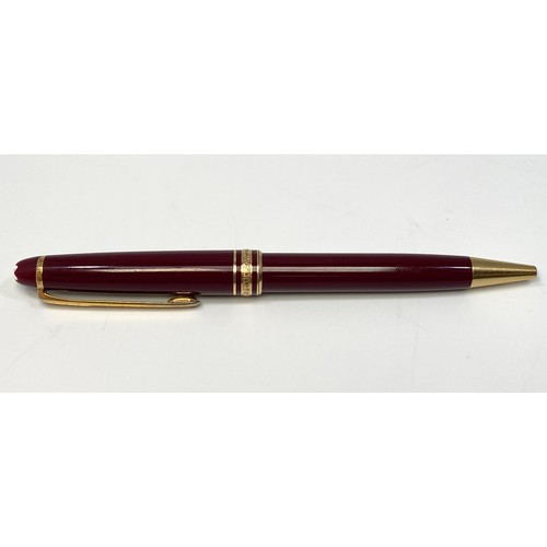 394 - A Montblanc Meisterstuck Pix ballpoint pen, with maroon resin body and gilt mounts, serial no. MG116... 