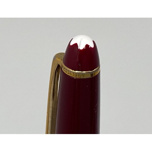 394 - A Montblanc Meisterstuck Pix ballpoint pen, with maroon resin body and gilt mounts, serial no. MG116... 