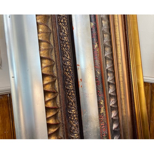 383 - Approximately 15 picture frame lengths in various colours and mouldings, the longest approx. 4m